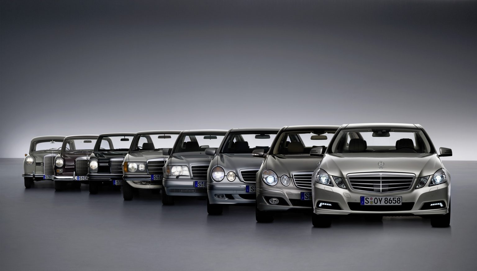 The tradition of the Mercedes-Benz E-Class. From left to right: Ponton Saloon (W 120/W 121), Tail Fin Saloon (W 110), Stroke/8 (W 114/W 115), model series 123, model series 124, model series 210, model series 211 and model series 212.
